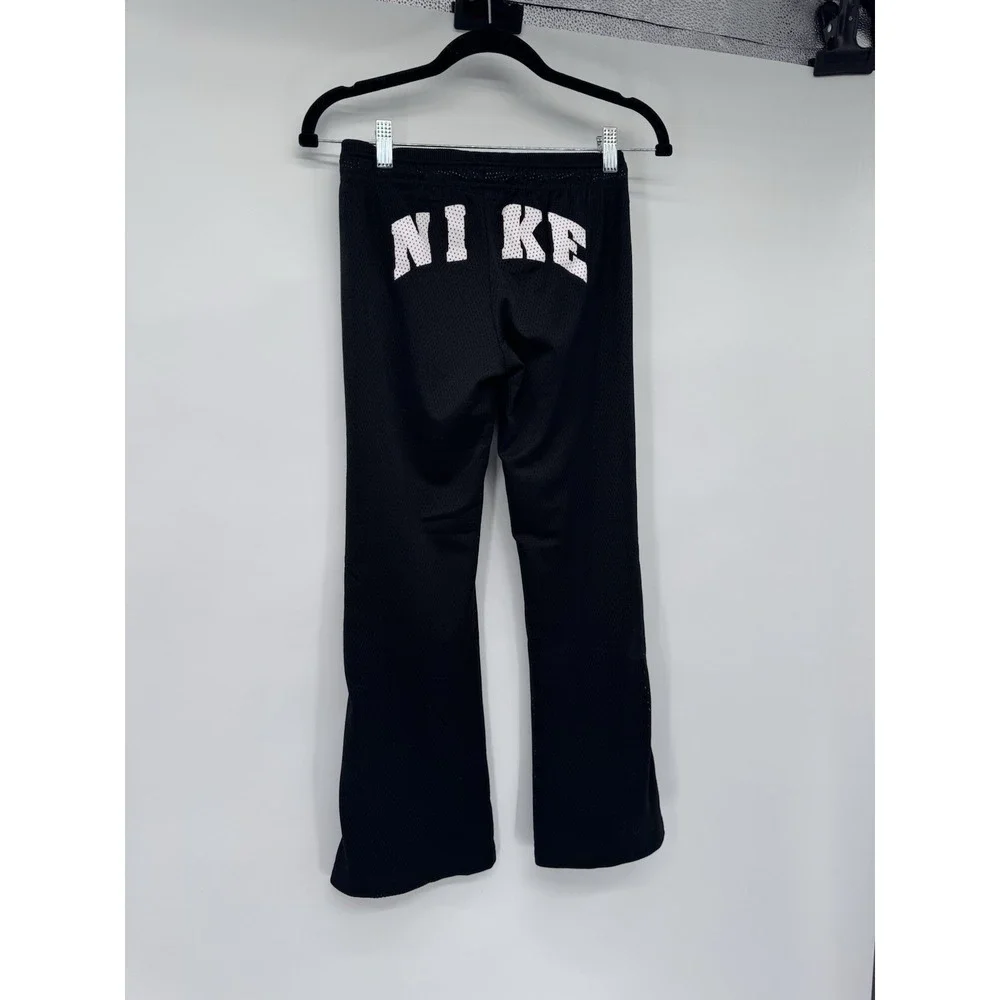 Nike girl M mesh lined snap side back logo flare pants athletic Y2K 90s preppy